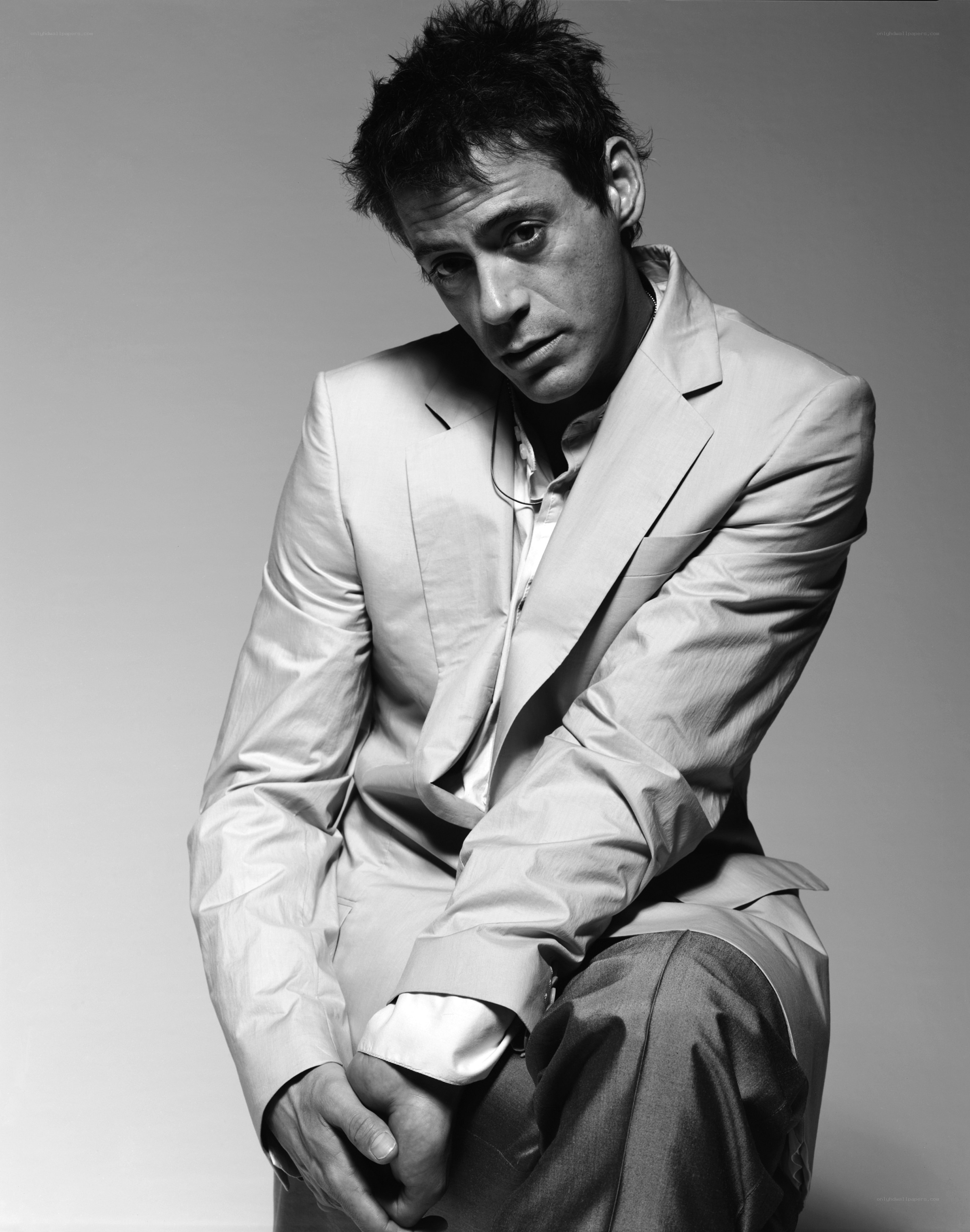 man in light suit posing