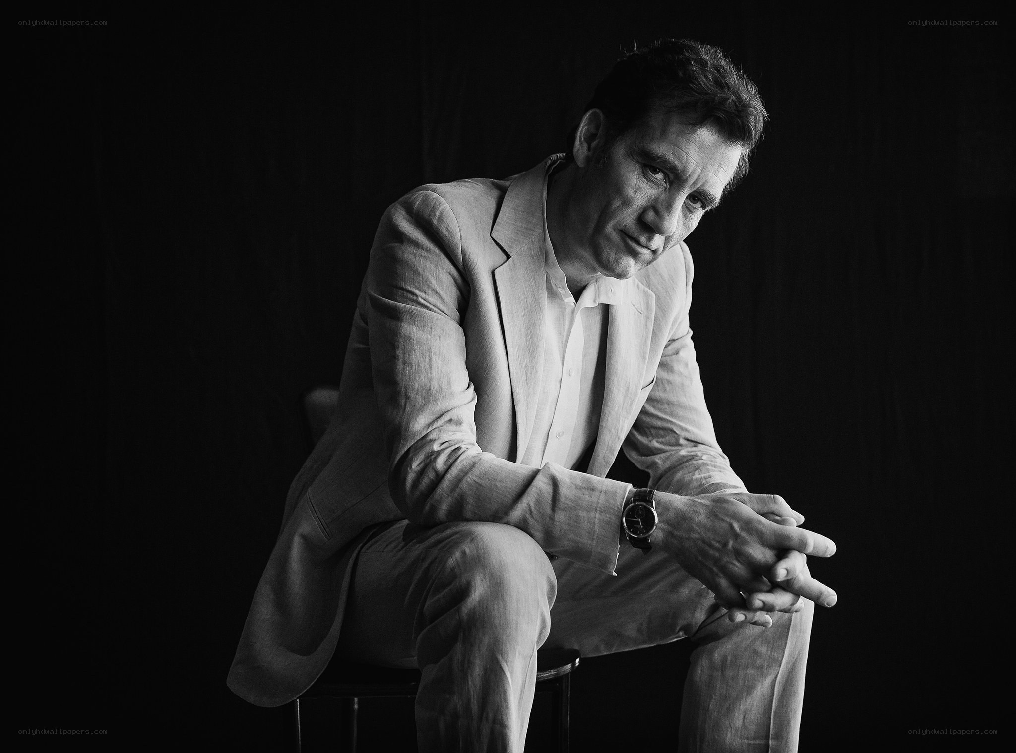 man in light suit sitting