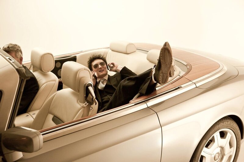 Man in luxury car on phone