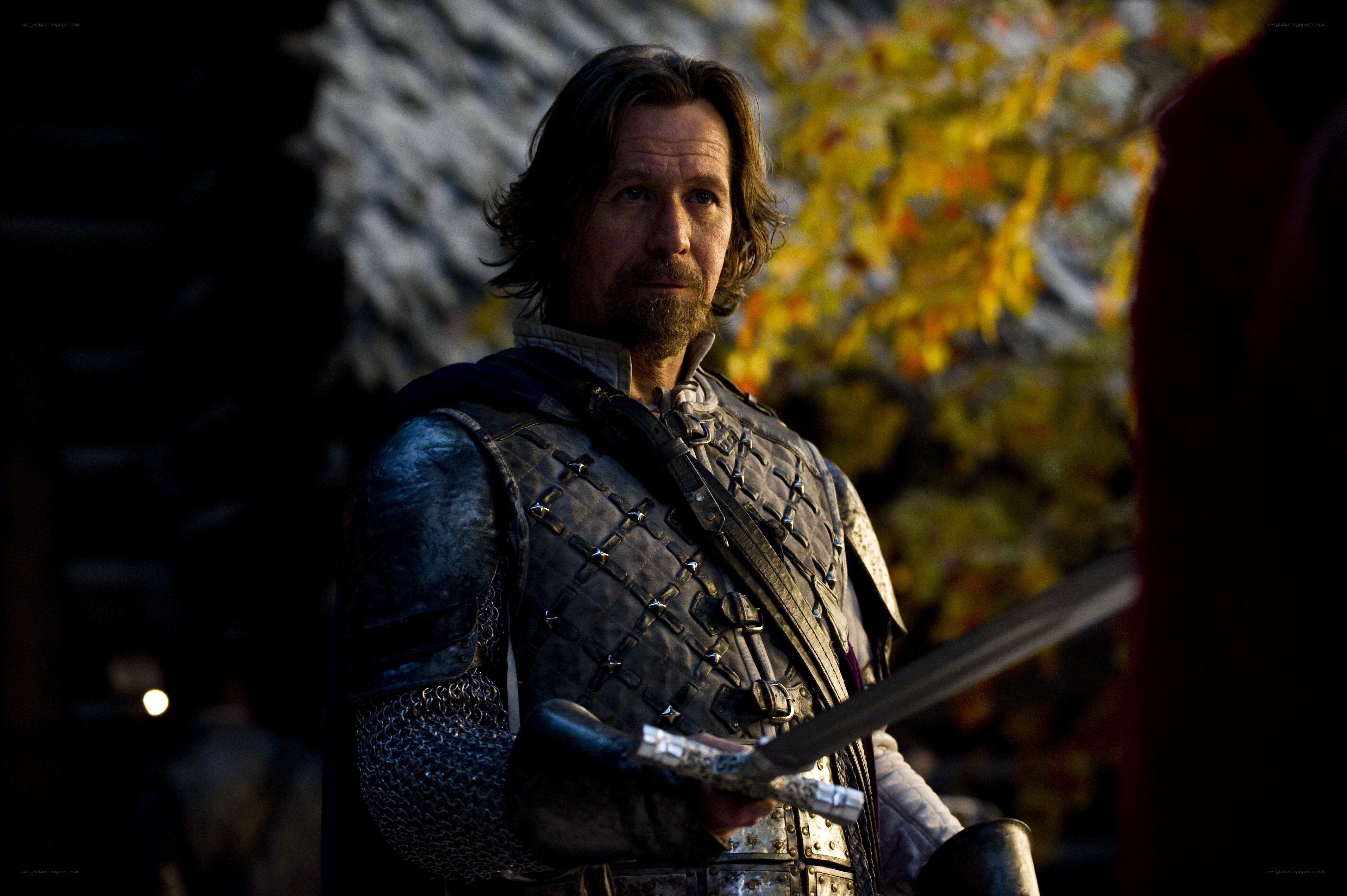 man in medieval armor holding sword