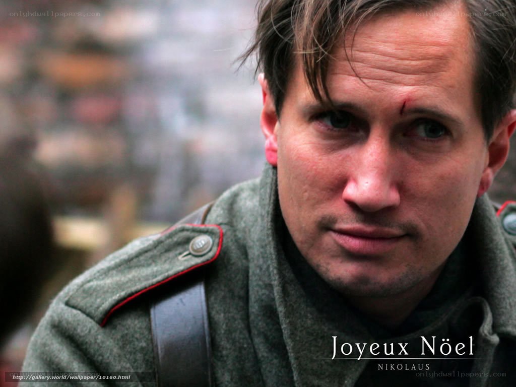 Man in military coat with injury