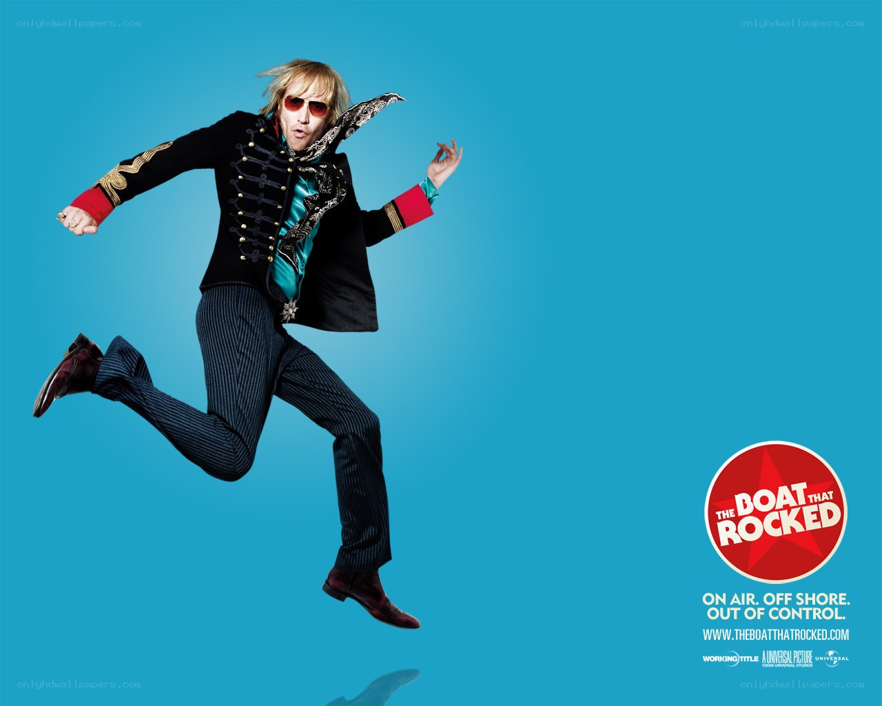 man in military-style jacket jumping