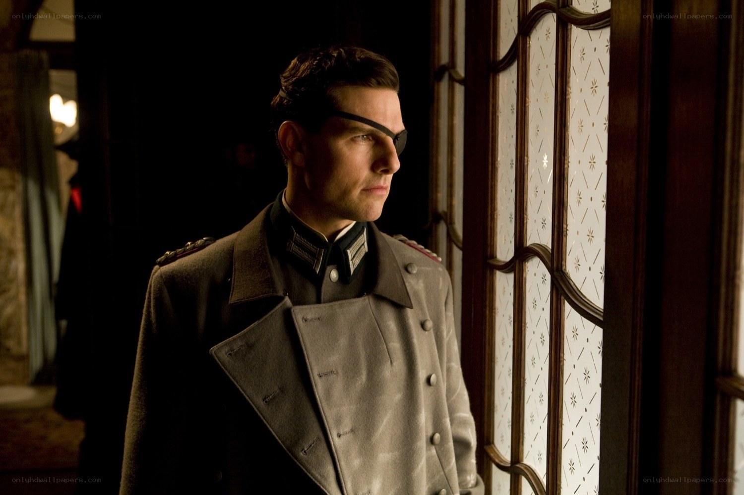 man in military uniform by window