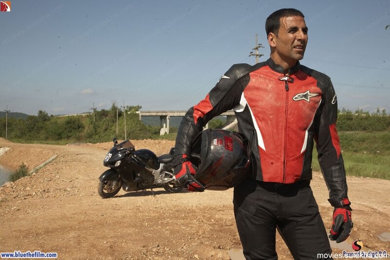 man in motorcycle gear with bike