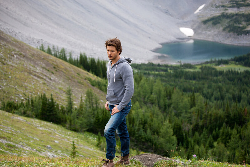 Man in mountains with lake