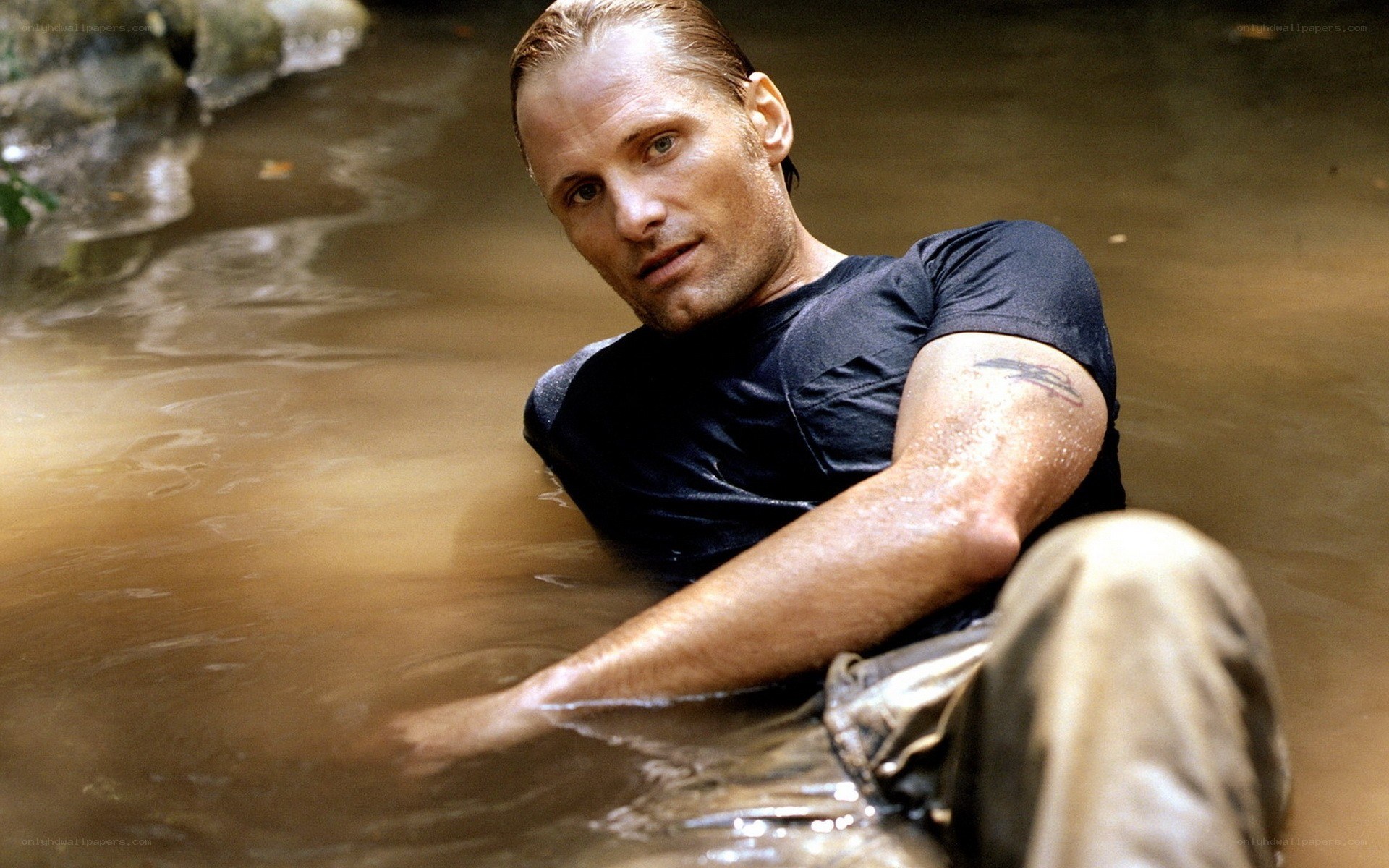 man in muddy water
