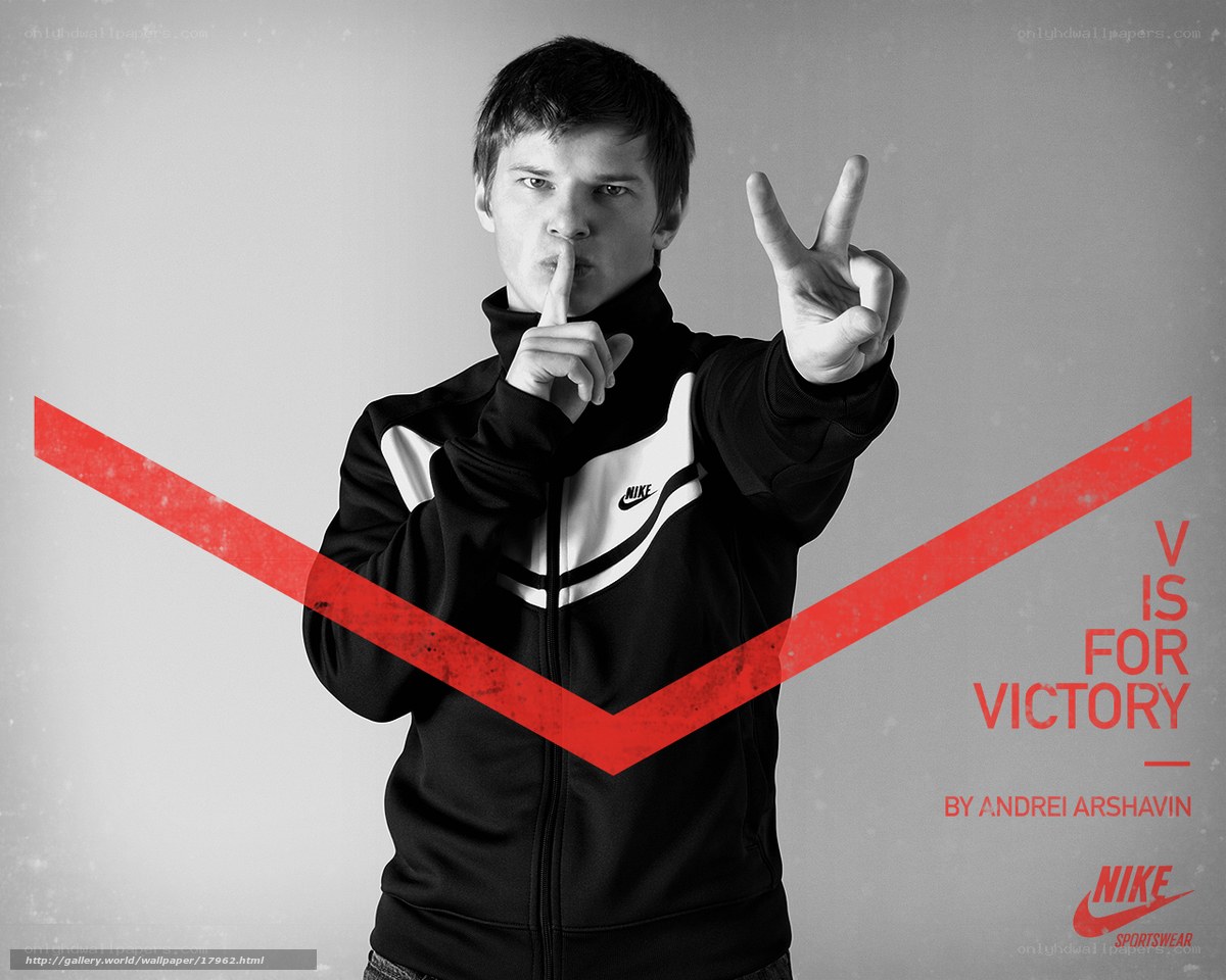 man in nike jacket making victory sign