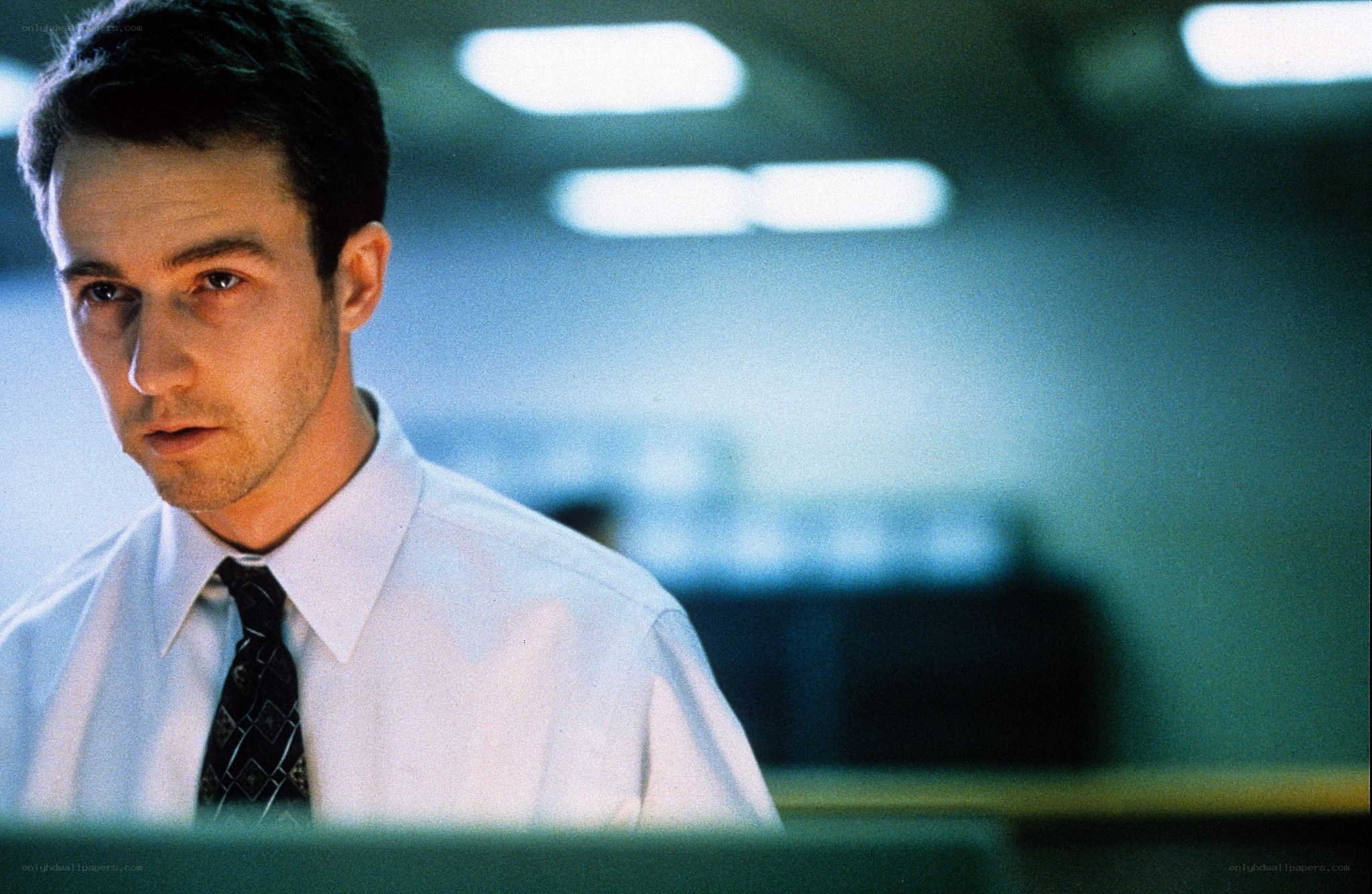 man in office looking at computer
