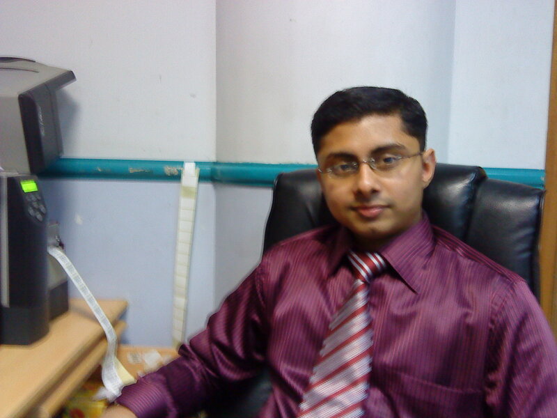 man in office wearing purple shirt