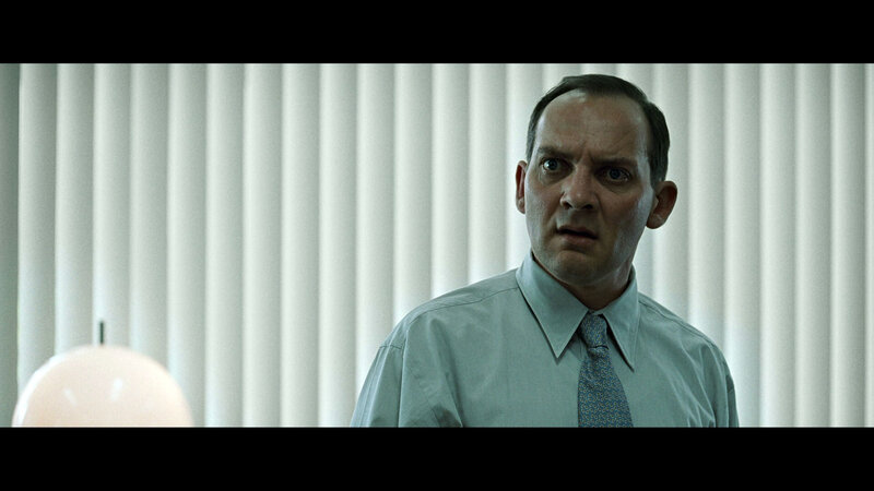 man in office with shocked expression