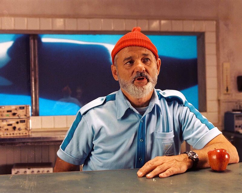 Man in orange beanie at counter