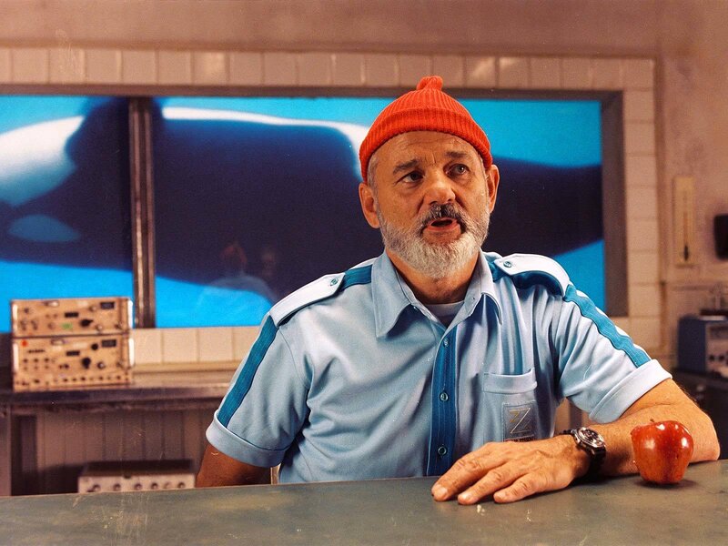 Man in orange beanie at counter