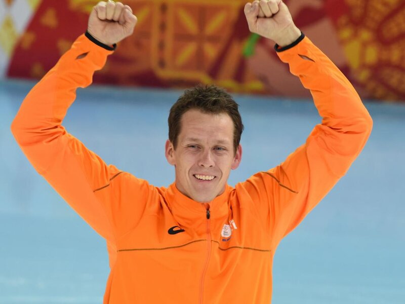 Man in Orange Jacket — Celebratory, Photograph, Fists