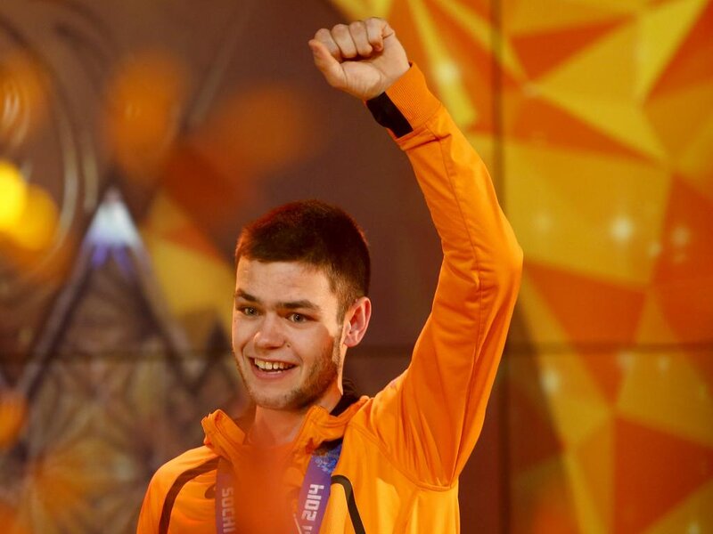 Man in Orange Jacket — Celebratory, Photograph, Medal