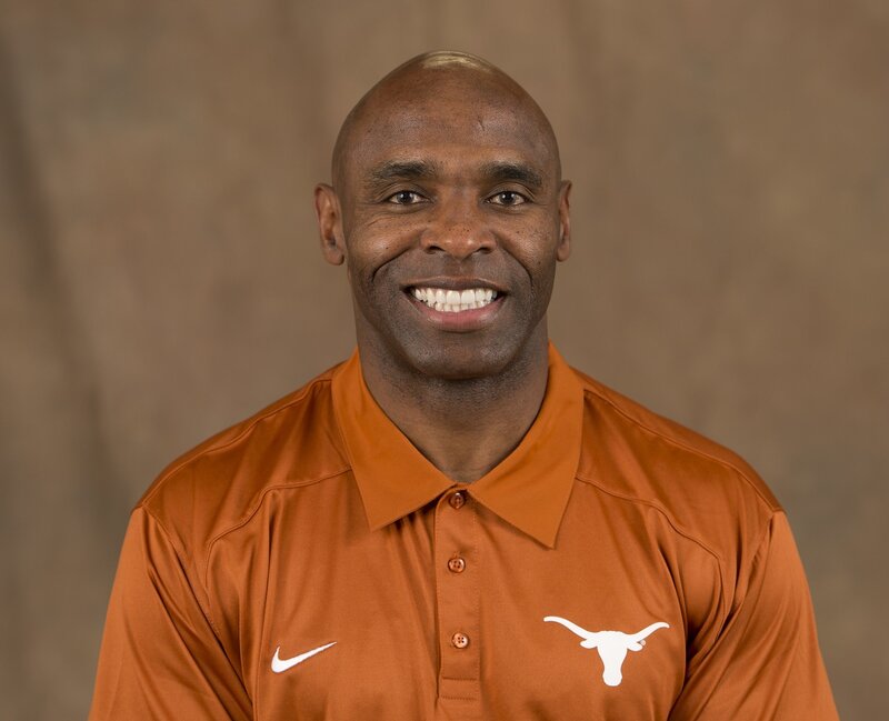 man in orange polo shirt