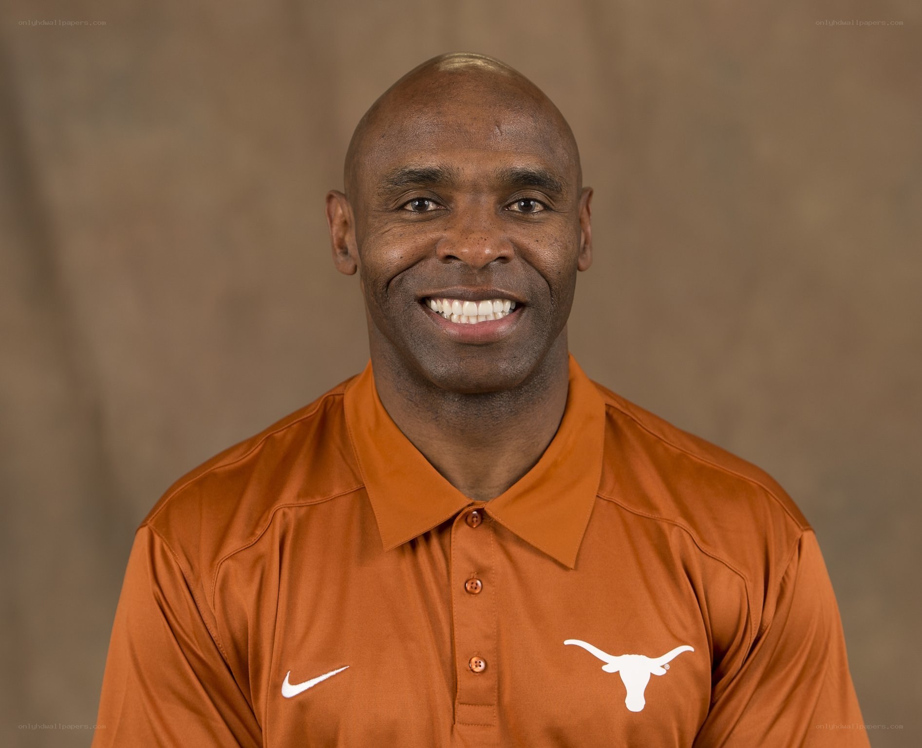 man in orange polo shirt