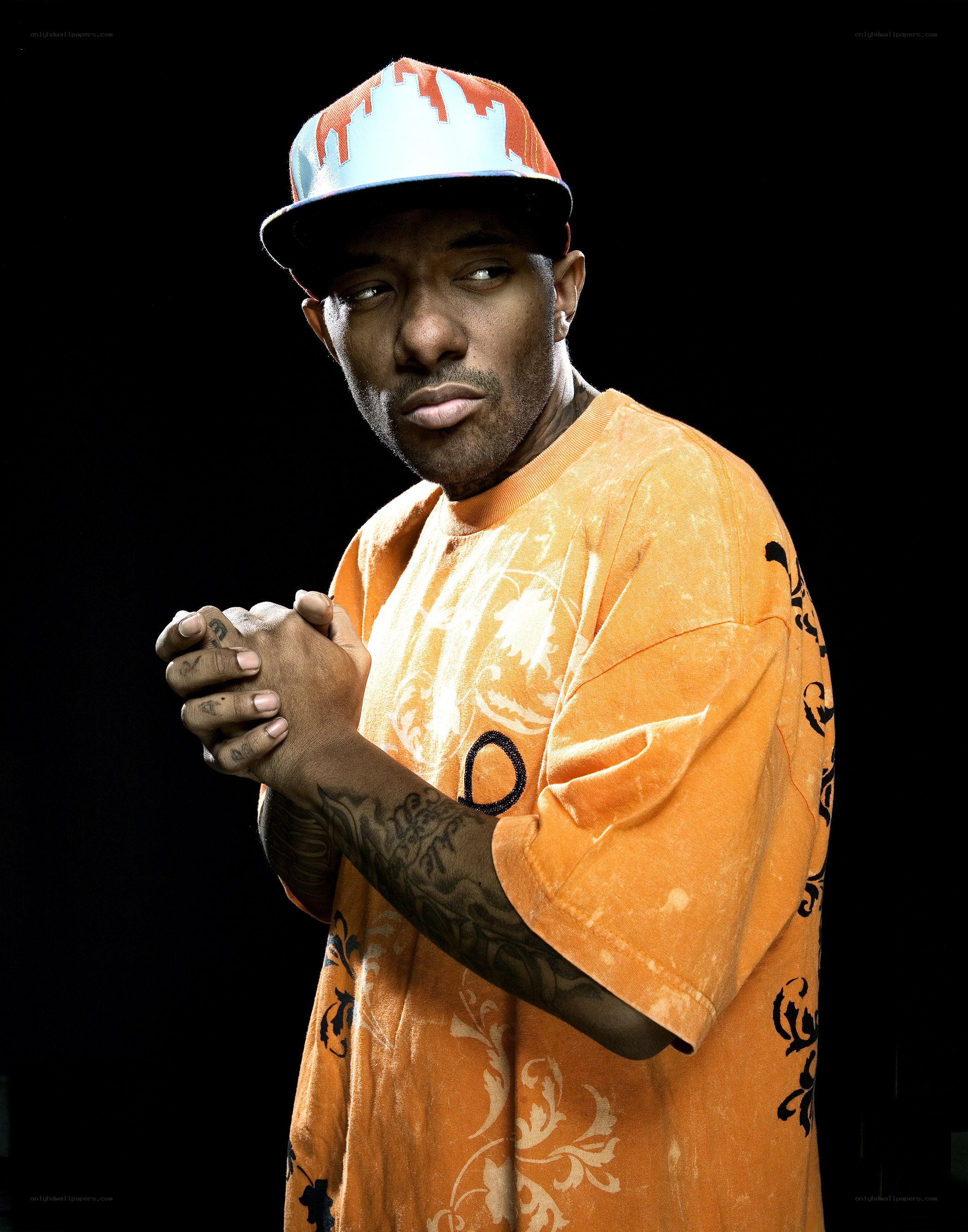 Man in orange shirt and cap