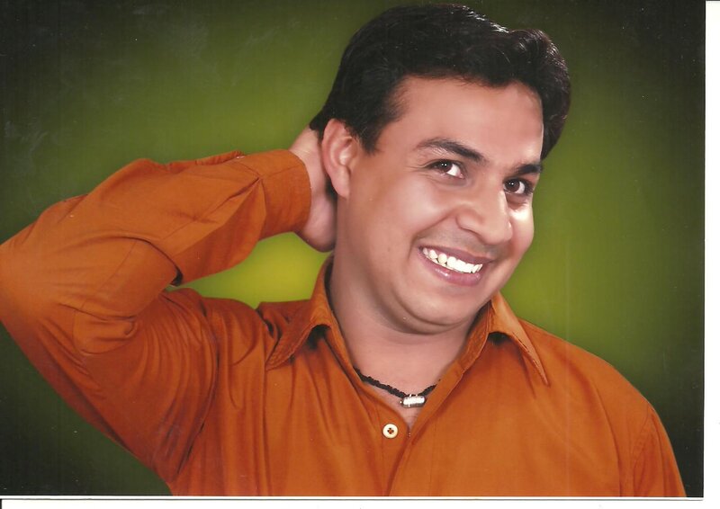Man in Orange Shirt — Smiling