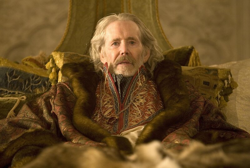 Man in ornate robe sitting