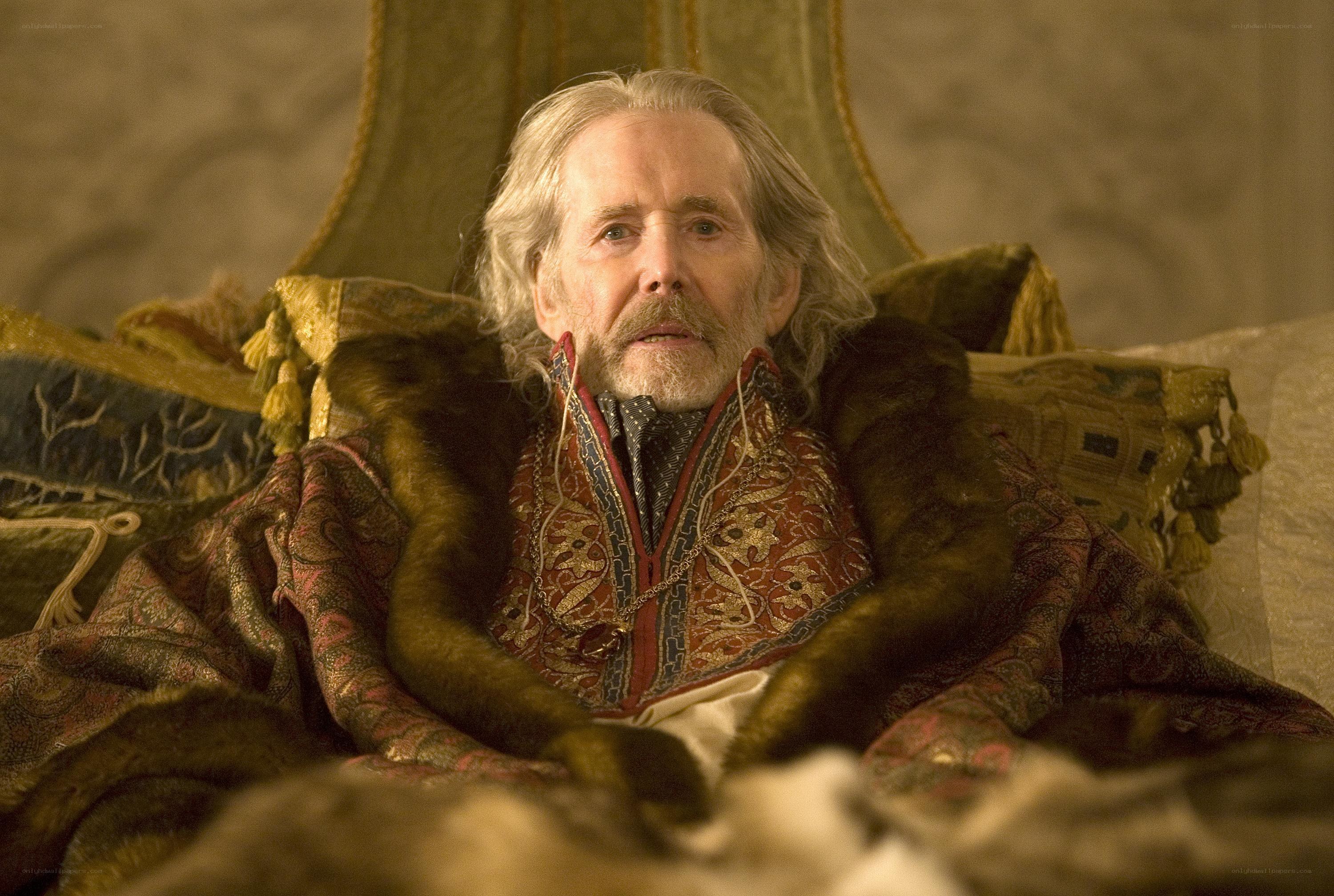 Man in ornate robe sitting