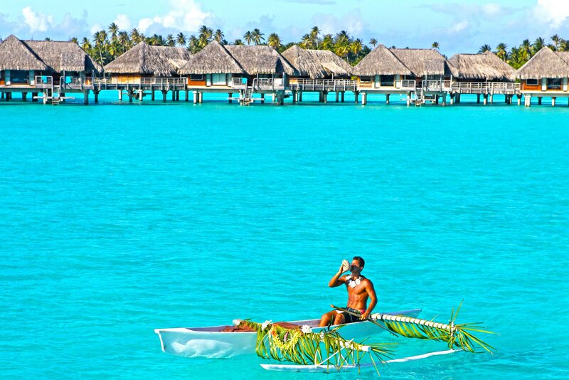 Man in Outrigger Canoe — Blue