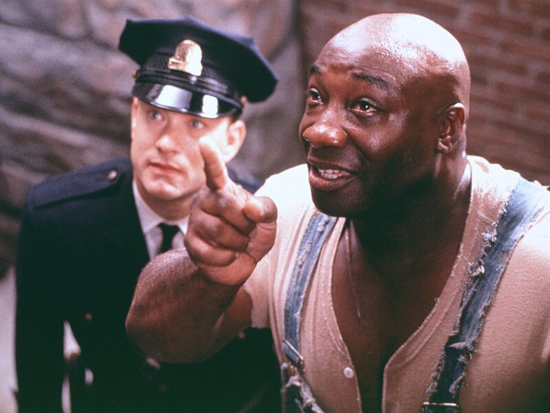 Man in Overalls Pointing