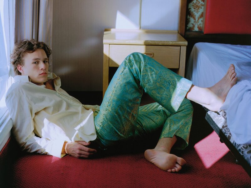 man in pajamas on floor