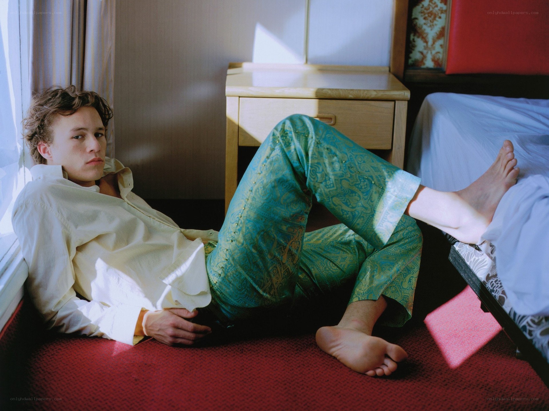 man in pajamas on floor