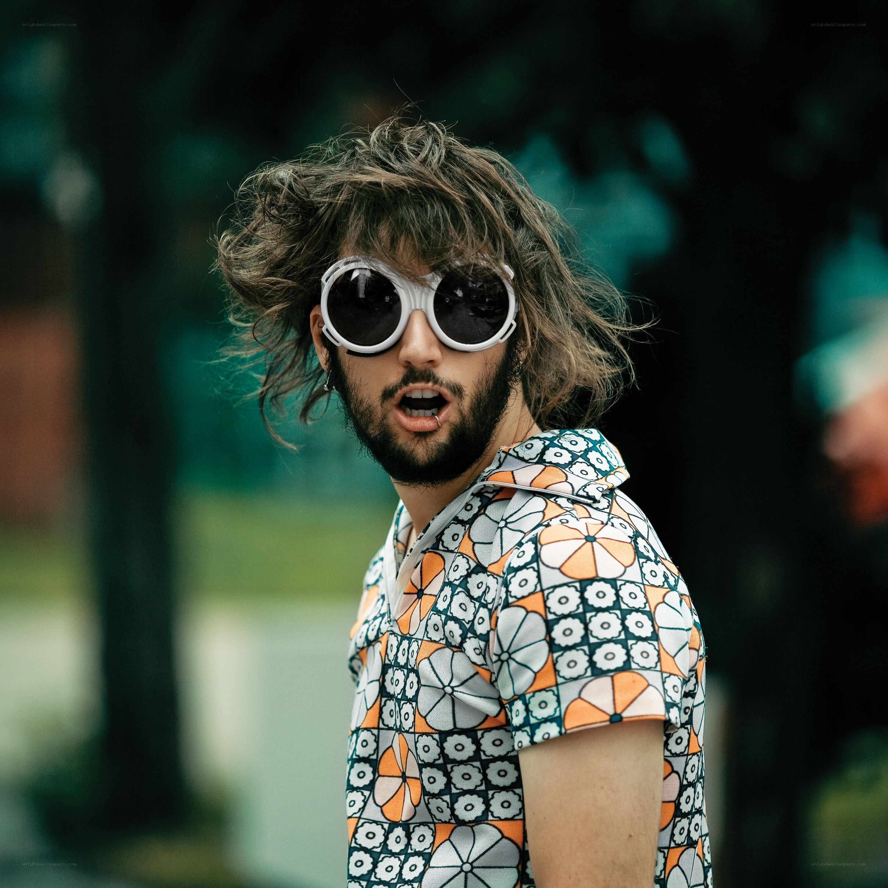man in patterned shirt and sunglasses