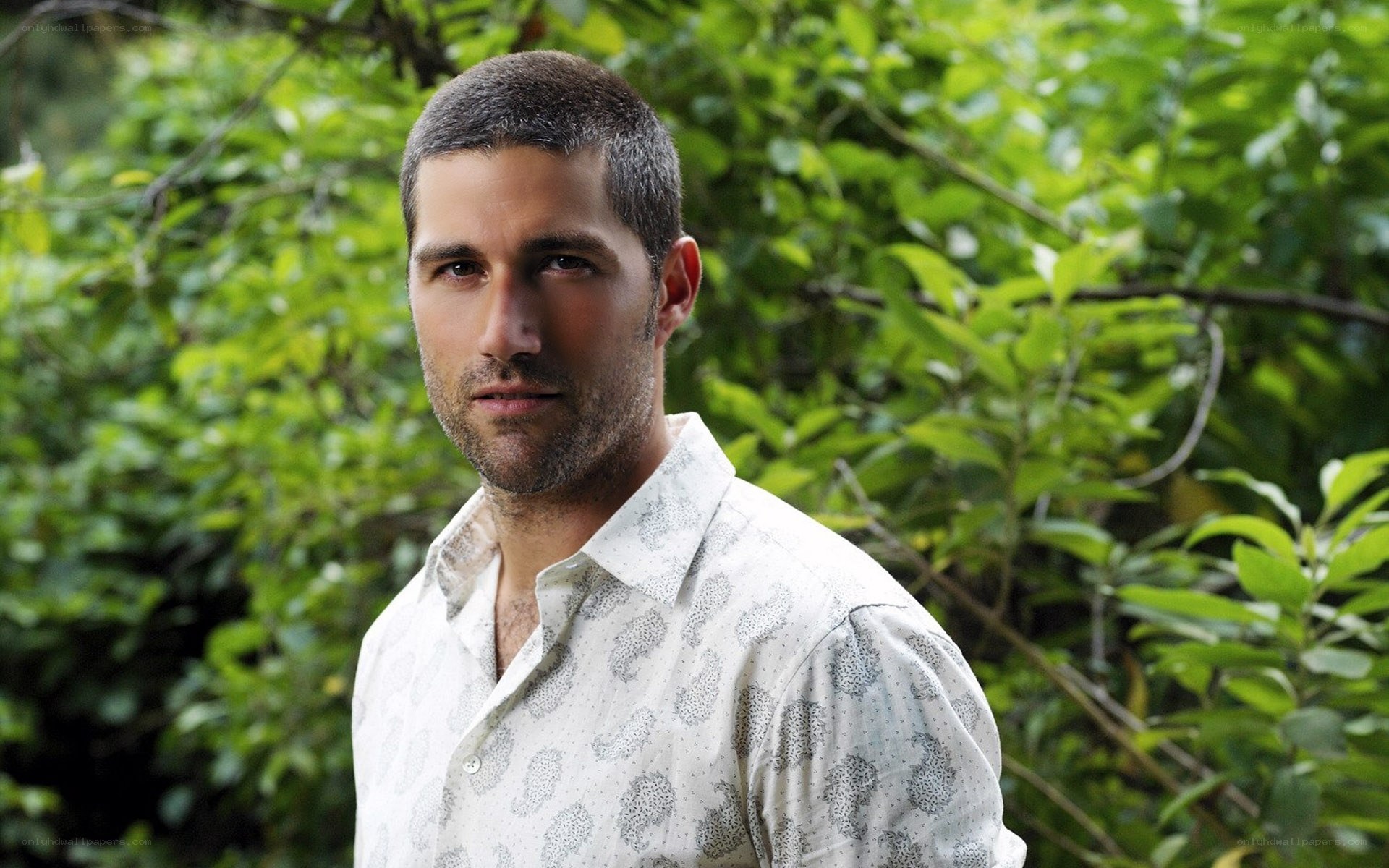 man in patterned shirt outdoors