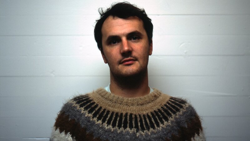 man in patterned sweater