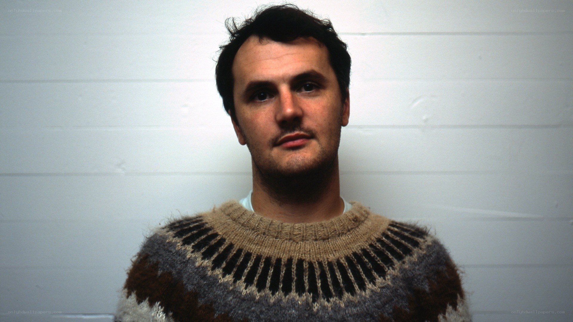 man in patterned sweater
