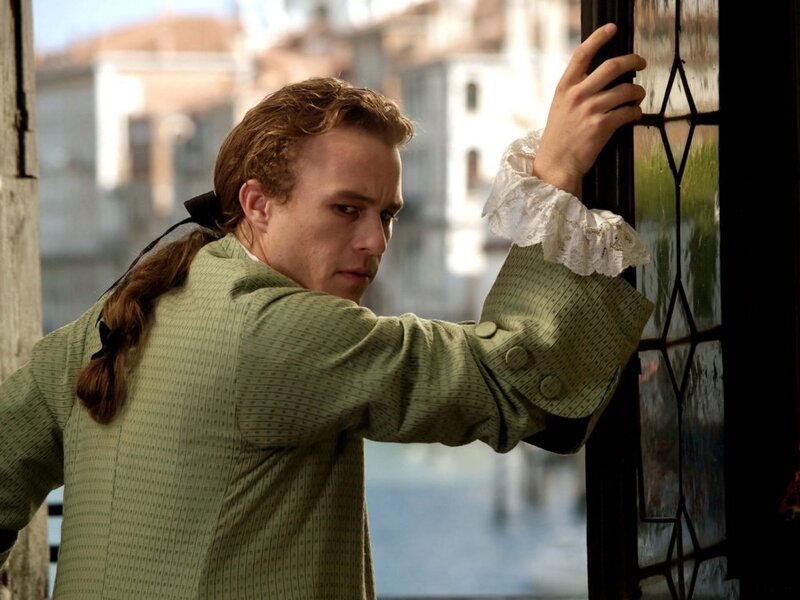man in period clothing at window