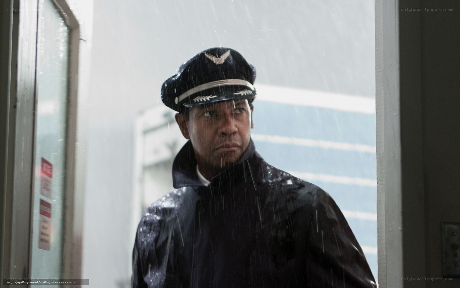 man in pilot uniform in rain