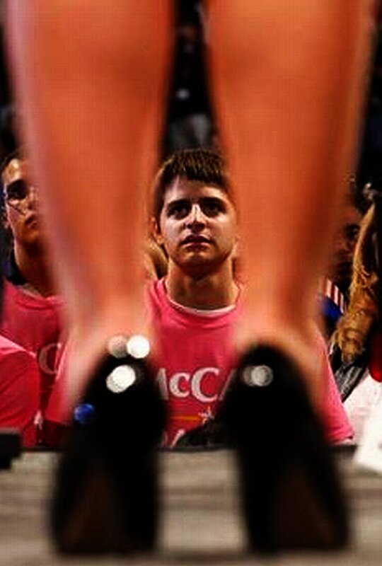 man in pink shirt at event