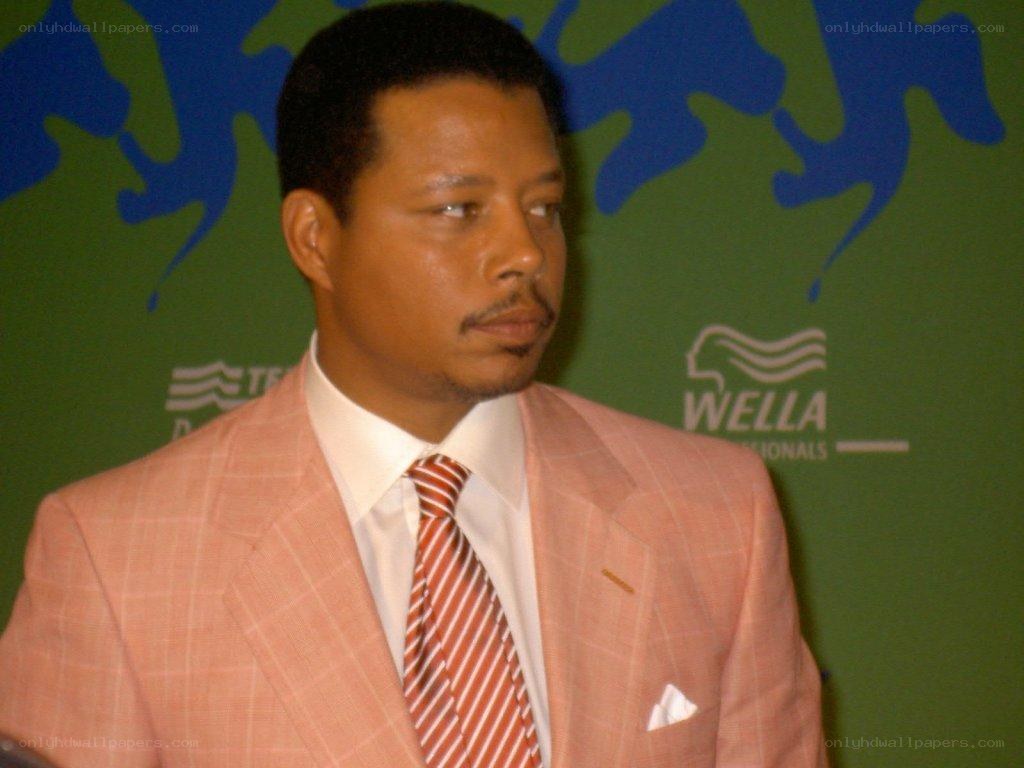 man in pink suit at event