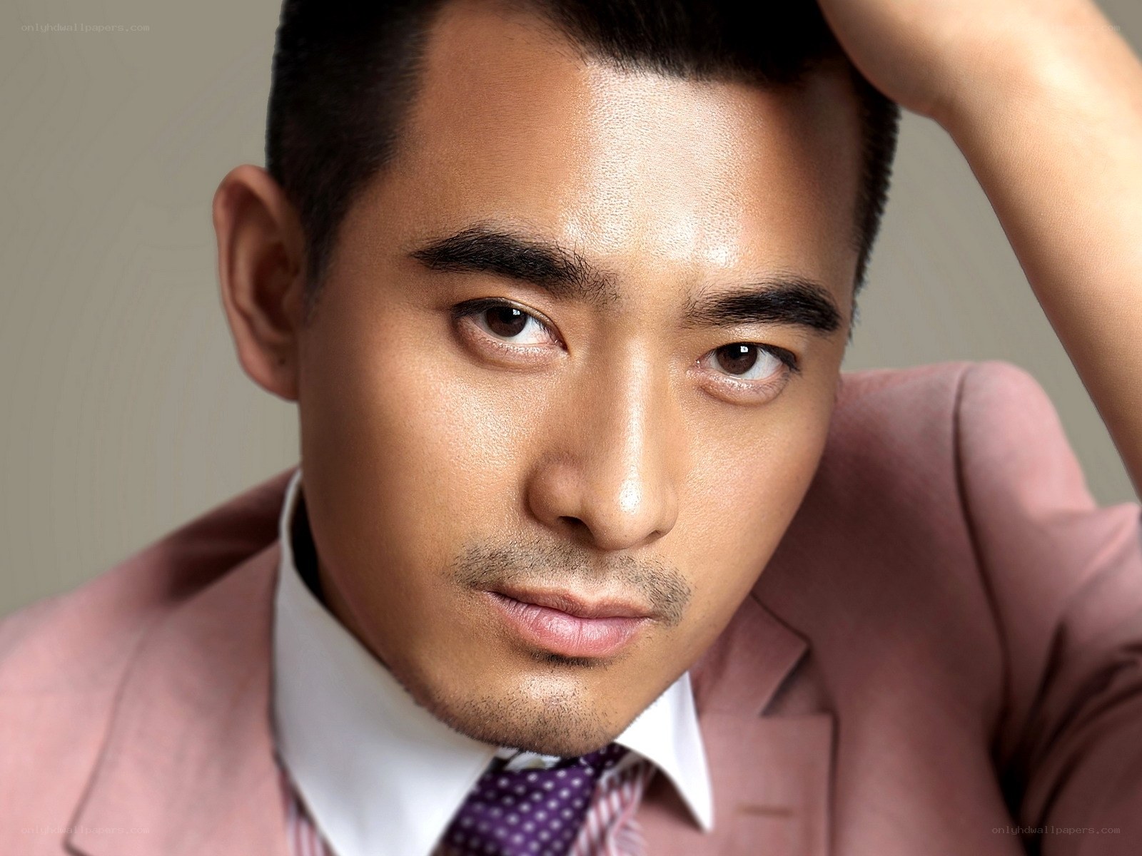 man in pink suit portrait