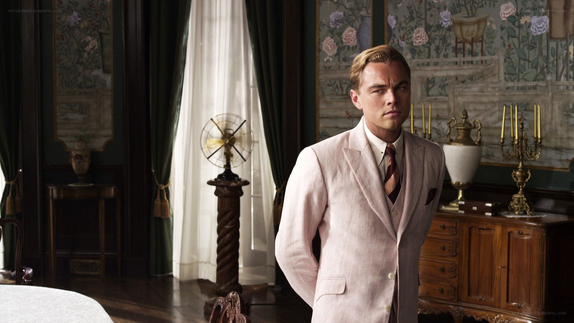 man in pink suit standing