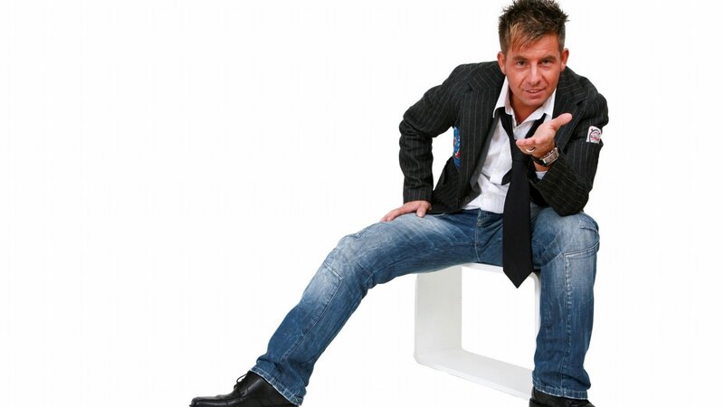 man in pinstripe jacket sitting