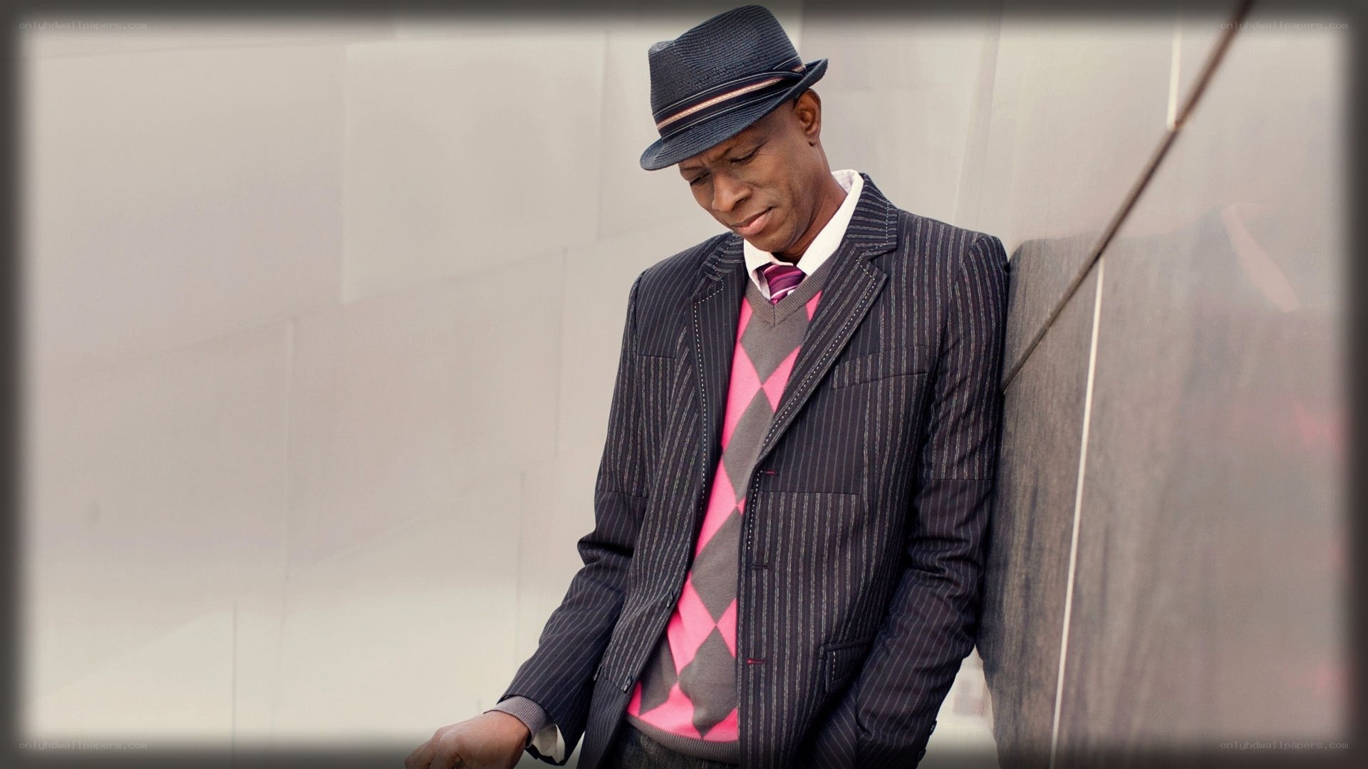 Man in pinstripe suit and hat