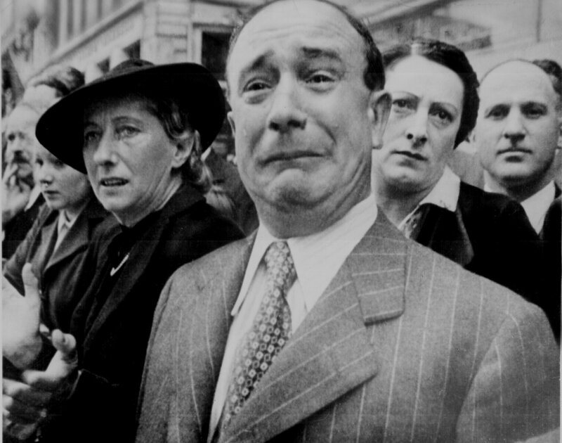 Man in pinstripe suit at public event