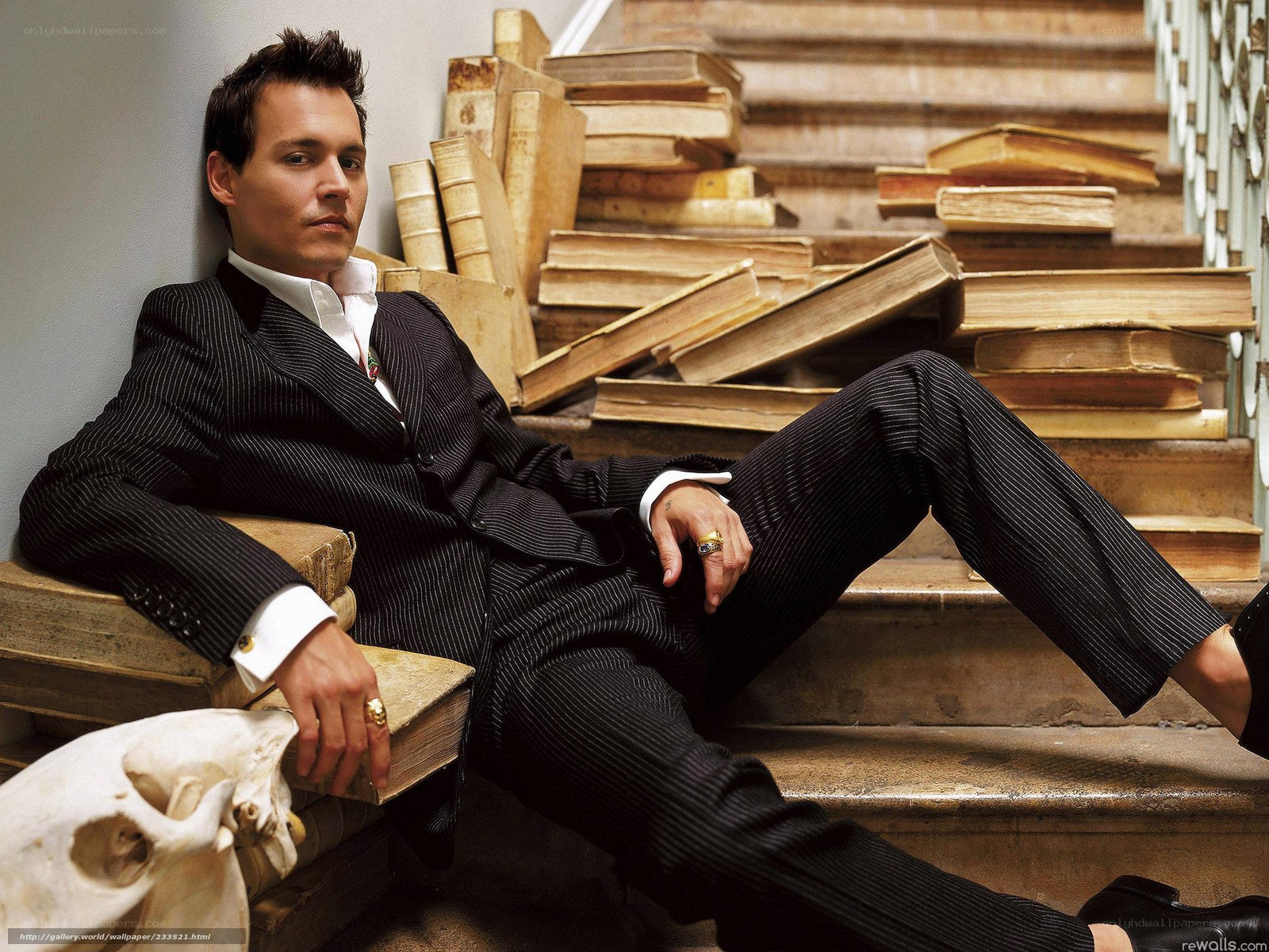 Man in pinstripe suit on stairs