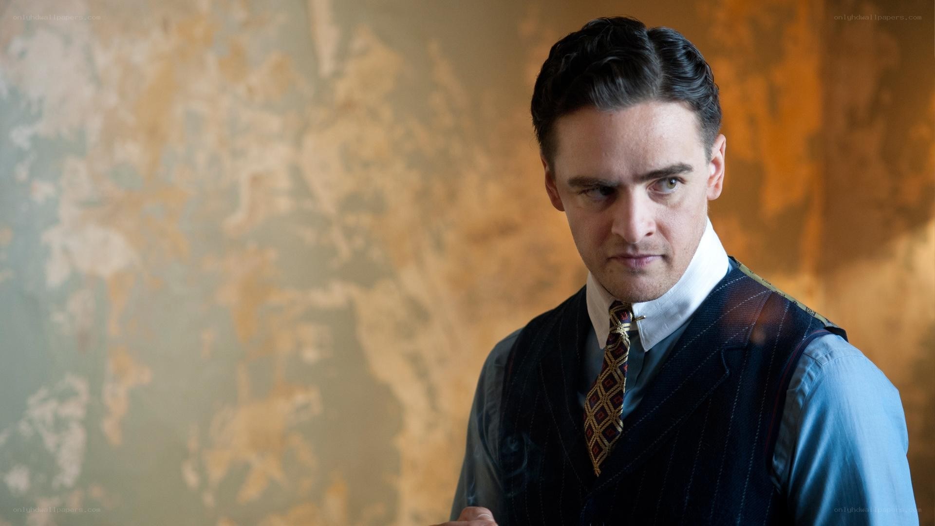 man in pinstripe vest