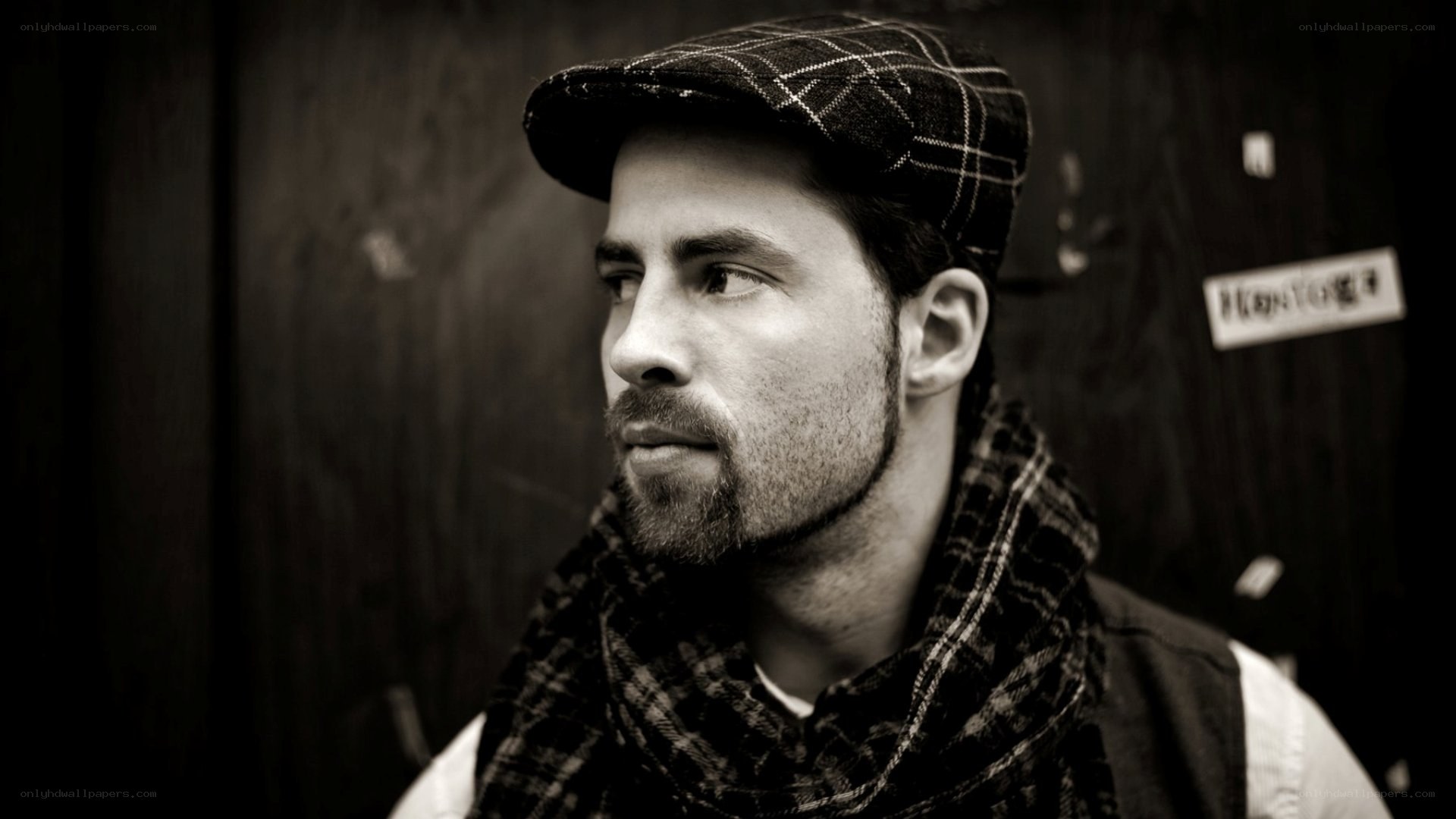man in plaid hat and scarf