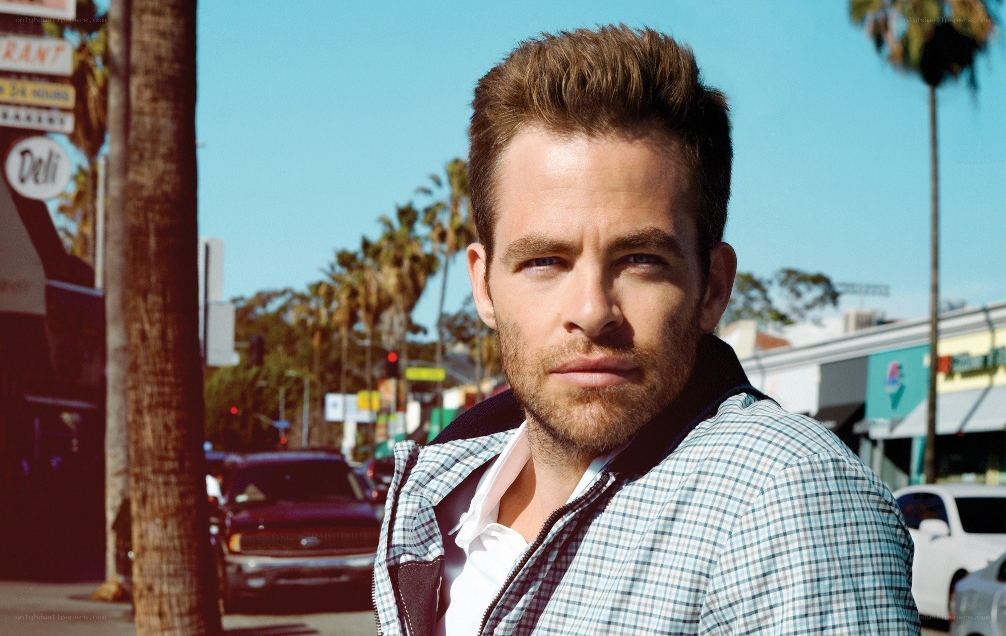 man in plaid jacket on street
