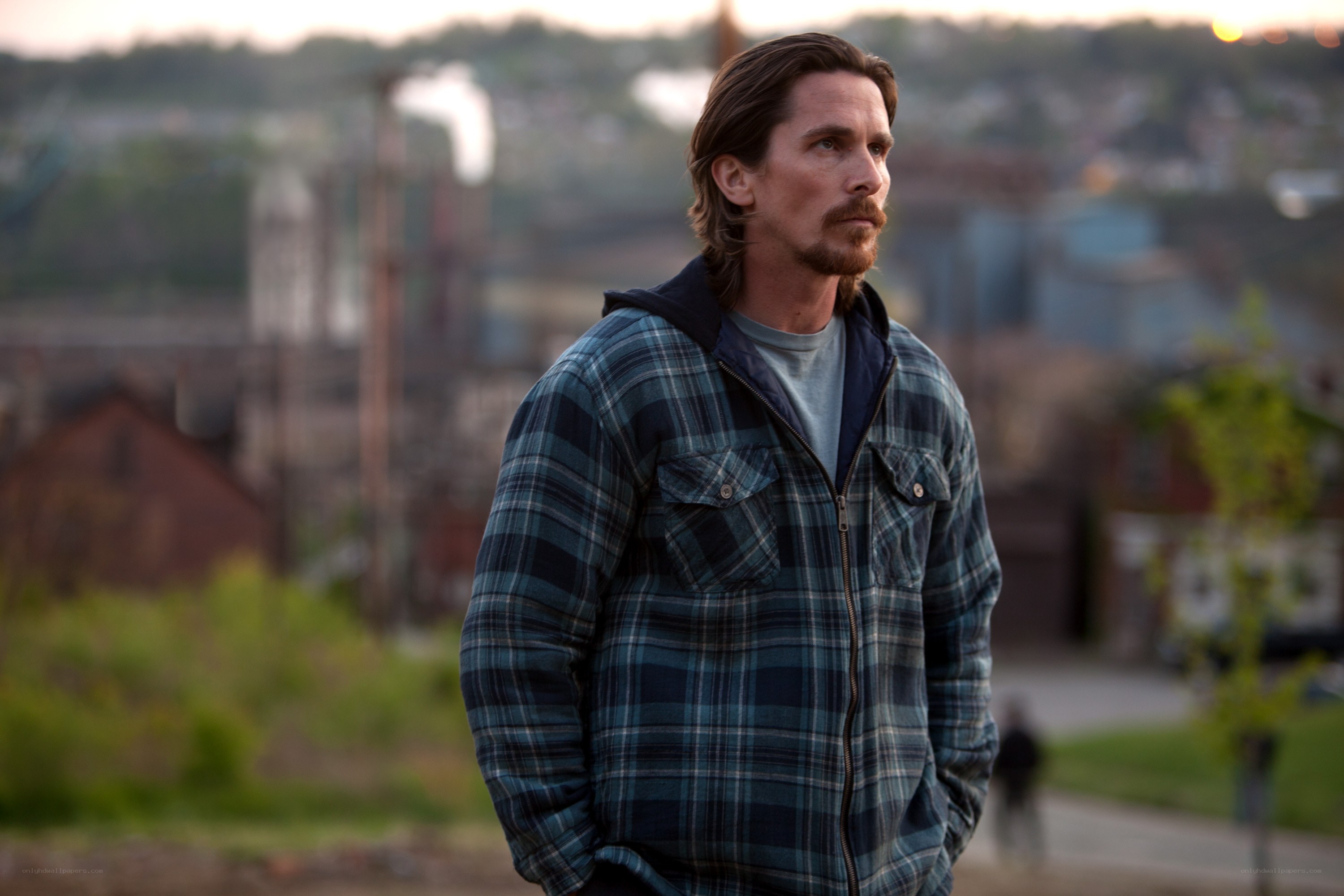 man in plaid jacket outdoors