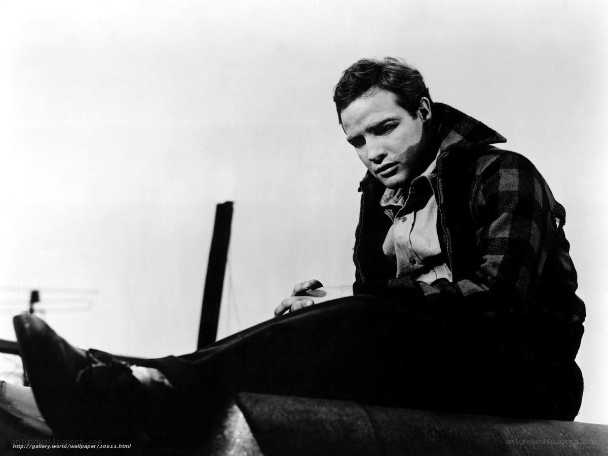 man in plaid jacket sitting