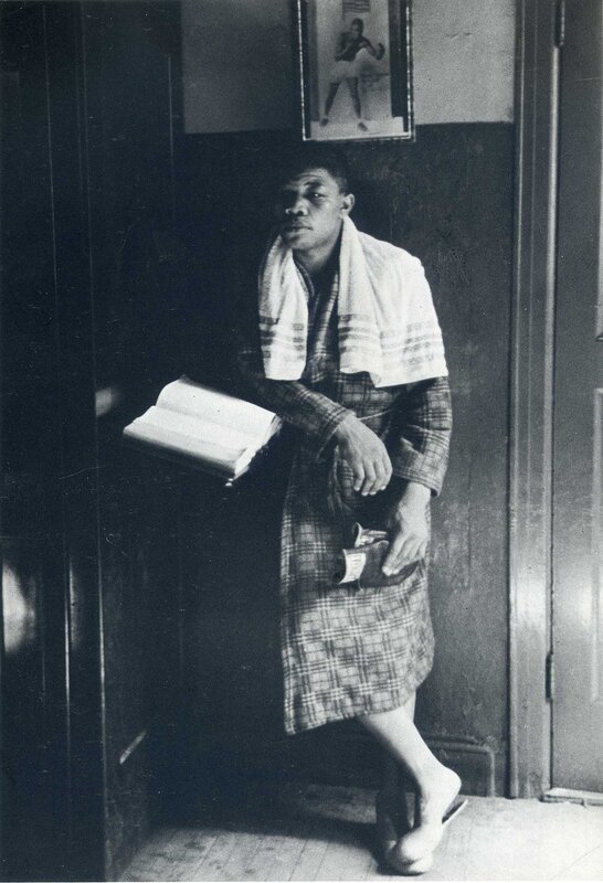 Man in plaid robe with towel