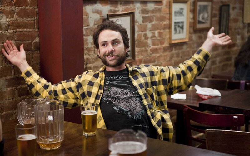 man in plaid shirt at bar