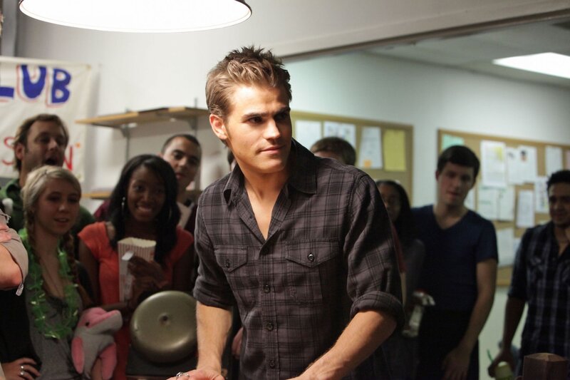 man in plaid shirt at party